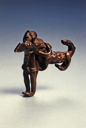 Aerial attack by a leopard on an armed man (brass)