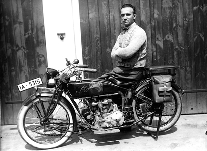 Portrait of a man sitting on a motorcycle. Photography around 1922