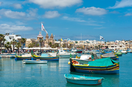 Colorfully painted traditional fishing boats; Luzzu; harbour of Marsaxlokk; Malta; Europe