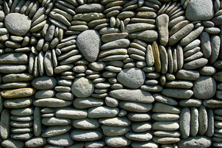 Pebbles artfully piled on top of each other as a wall; near Ubud; Bali; Indonesia; Southeast Asia; Asia