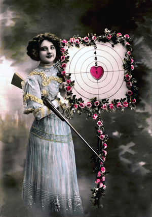 Cupid woman with a rifle and a target whose center is shaped like a heart. Red tone photography, 1915