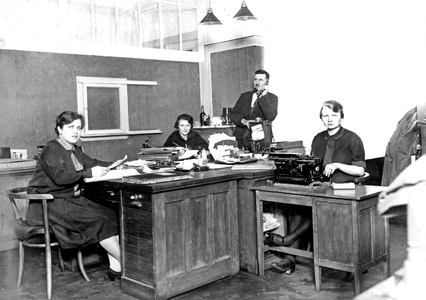 Office with female secretaries and their boss.