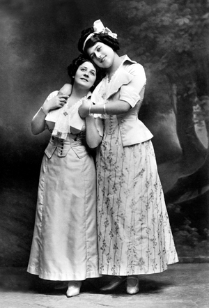 Barbara Chastes, two women holding in arms looking happy.