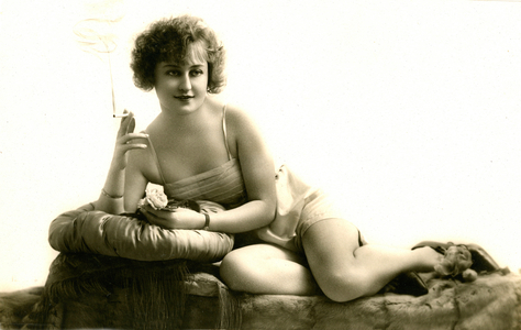 Postcard with young woman in intimate lingerie smoking a cigarette 1920