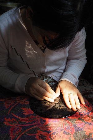 Myanmar - Burma: Bagan, lacquer workshop. Print engraving on the last layer of lacquer before gilding