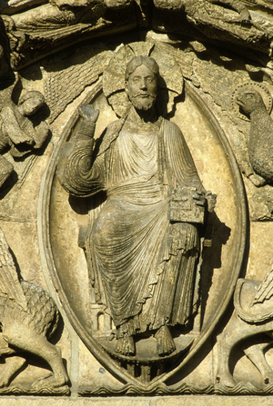 Sculpture of the royal portal of the Cathedrale Notre Dame a Chartres (Eure et Loir), France: Christ in Majeste (in glory) surrounds with a mandorle.