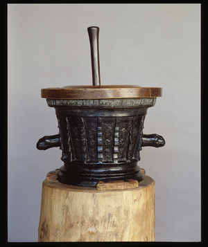 Apothecary mortar and pestle, 1497. Diameter of 45 cm and height with pestle: 63 cm; without pestle and 35 cm. Wood and bronze. Musee de l'hospice Saint-Roch, Issoudun. Mandatory mention