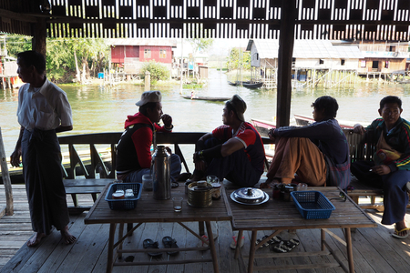 Myanmar - Burma: Inle Lake, Shan State. House on stilts and boats. Time of the day. The height of the stilts corresponds to the height of the water during the monsoon, June to October