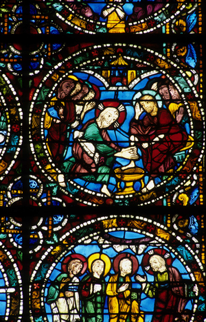 Gothic architecture. History of the Passion of Christ (detail): the enema of the feet. Stained glass from the bottom of the royal protrail. Cathedrale de Chartres.