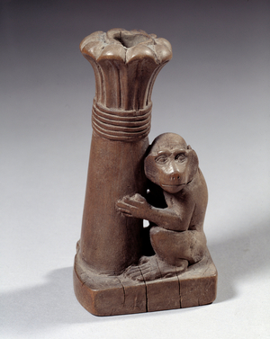 Art Egypt: vase a kohol monkey holding a colonette palmiform new empire (wood)