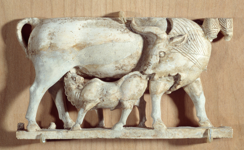 Ancient Oriental Art: ivory cow nursing her calf. Low relief, c.750 BC (ivory)