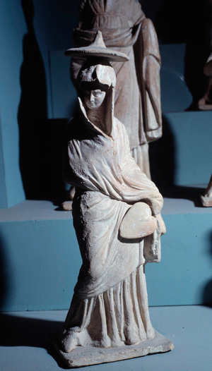 Terracotta figurines: woman standing draped with a fan, in the style “Tanagreen”., 320-300 BC (terracotta)