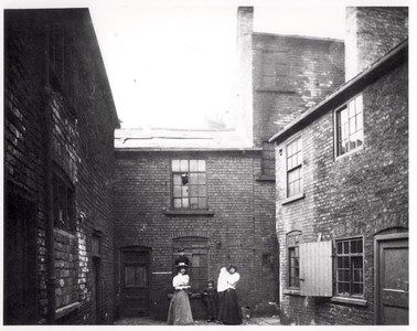 Two women pose with their children, Eagle and Child Yard, Hunslet, Leeds, 13th May 1896 (b/w photo)