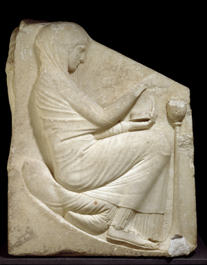 Trone Ludovisi (belonging to the collection of Cardinal Ludovico Ludovisi): right relief depicting a woman wearing a chiton (tunic) and a himation (mantle) throwing incense seeds in a Thymiaterion (burner perfume) - 470-460 BC - Marble relief - Palazzo Altemps, Rome, National Museum Magna Graecia (Great Greece): Ludovisi Throne, woman placing incense in a Thymiaterion - Right panel detail, Marble relief, 460-450 BC, from Rome, Villa Ludovisi (Horti Sallustiani) - Roma, Museo Nazionale Romano
