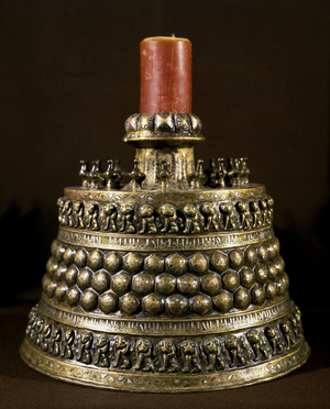Islamic Art: bronze candlestick with silver inlay. Persian art of the 12th century. Cairo, Museum of Islamic Art