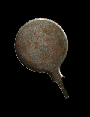 Etruscan civilization: mirror decor of a representation of Uni (etruscan equivalent of Hera) nursing Hercules (Heracles) - End of 4th century BC - From Volterra - Dim 19 cm Florence, Museo Archeologico, inv 72740