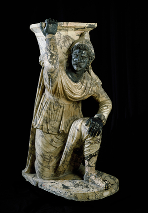 Persian servant statue kneels. Roman marble sculpture inspired by the school of Pergamo. 170-180 AD. Dim. 164 cm Museo Archeologico Nazionale, Naples