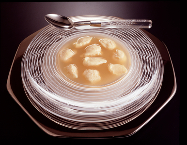 Food still life: plate of italian quenelles of semolina  (photography)