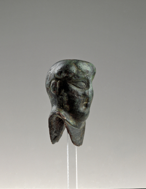 Stylised sword knob representing a man's head (bronze)