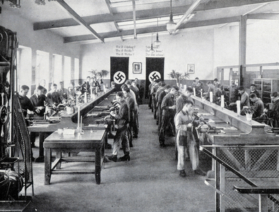 An apprentice workshop, decorated with swastika crosses, under the Third Reich