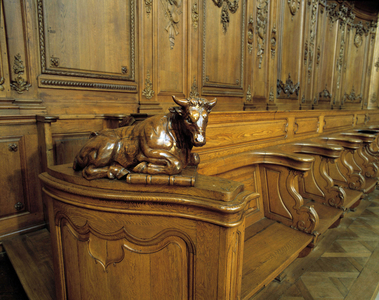 Baroque architecture: wooden stall representing an ox, attribute of the evangelist Saint Luke. Choir (18th century) of the Church of St. Stephen. Internal view. Marmoutier, Bas Rhin (67).