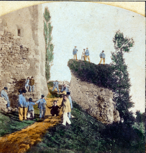 Colorated school photo showing young people playing during recreation, 1865