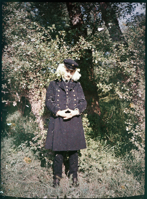 Fantasy portrait: Fantasy portrait showing a soldier in uniform, head between two clusters of flowers, 1920, France - Autochrome anonymous