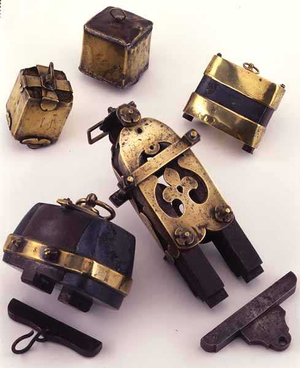 Collection of lodestones, a horseshoe iron magnet and two keepers, English or French, 17th-18th century (brass cased magnetite)