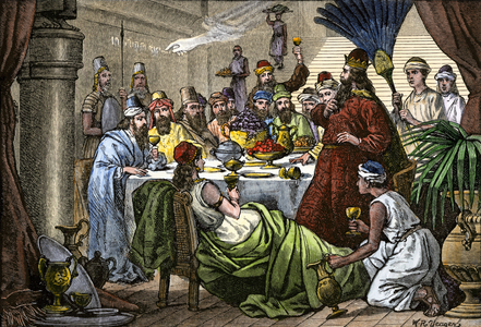 Biblical scene: Daniel reading the scripture on the wall for King Nebuchadnezzar II, ruler of Babylon. Colourful engraving of the 19th century