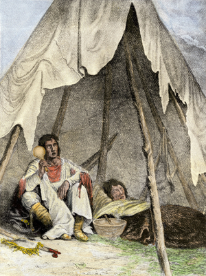 History of indigenous peoples: Shaman caring for a patient with songs and potions. 19th century coloring engraving.