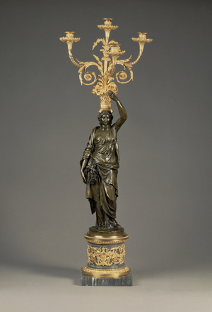 Louis XVI four-light candelabra, ormolu branches rising from a basket balanced on the head of a patinated bronze maiden standing on a cylindrical base of bleu turquin marble, c.1775