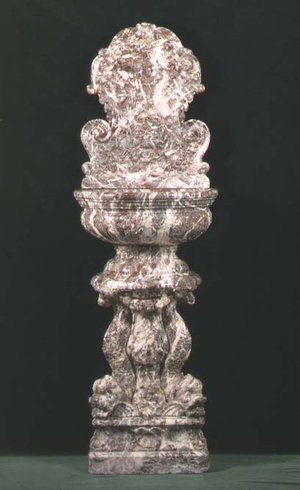 Louis XIV fountain or wine cooler, consisting of a rounded basin with backplate supported by carved dolphins, 18th century (marble)