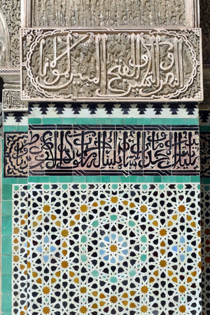 Fes (Fez), Morocco, medersa Bou Inania edifiee between 1350 and 1355 for Sultan Abu Inan Faris (Abu Inan Faris) (regne 1348-1358) during the Merinides dynasty - stucco - mosaic - zelliges - cursive writing frieze - verses from the Quran - Photo Patrice Cartier -