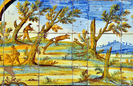 Naples, Italy (Napoli, Italia): chiostro maiolicato, monastero di Santa Chiara - majolic cloister (of faience) of the monastery of Santa Chiara, mid 18th century - majolic decorees of mythological scenes, landscape and polychrome maritime scenes, due to the ceramists Donato and Giuseppe Massa - wild boar hunting scene with crossbow and dogs - Photo Patrice Cartier -