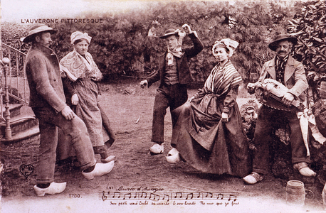 Bourree d'Auvergne: a group of Auvergnats in traditional costume and hooves dance to the sound of the old wheel. Postcard beginning 20th century.