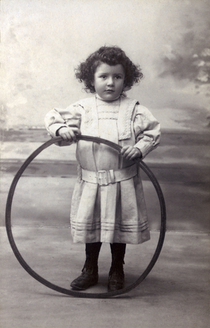 Portrait of a girl holding a hoop, c.1900 (photo)