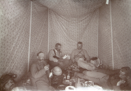 Members of the Arabah Survey expedition relaxing in their tent, 1883 (b/w photo)