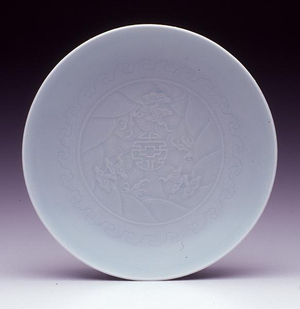 Dish, Yongzheng mark and period 1723-35 (carved porcelain with pale celadon glaze) (see also 142563)