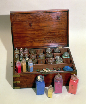 Mahogany box containing glass jars of dry pigment