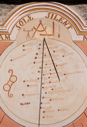 Sundial - Eglise d'Entraigues - Dial realized in 1843, restored in 1999. The central part indicates the solar noon of 37 places in the world, each represented by a red celestial star. The Latin motto means I refuse to say the time if the sun is silent. Hameau d'Entraigues, Saint Jean d'Arves, Savoy
