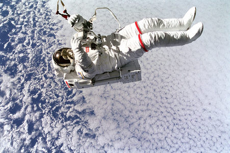 Extravehicular activity - Astronaut Mark Lee floats free of tether during EVA. Sep 16 1994
