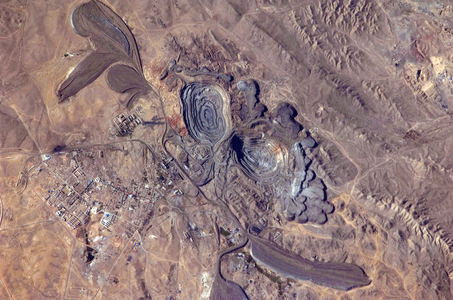 Bayan Obo Mine - China - Bayan Obo Mine - China: Bayan Obo is a mining town in Mongolia. It is the world's largest rare earth mining mine. Image taken from the International Space Station (ISS) on October 6, 2009. The Bayan Obo mine is a large niobium mine located in northern China in Inner Mongolia. The vast majority of rare earth-96 percent of the market - come from China. About half come from Bayan Obo. Astronaut photograph was acquired on October 6, 2009 from the International Space Station (ISS)
