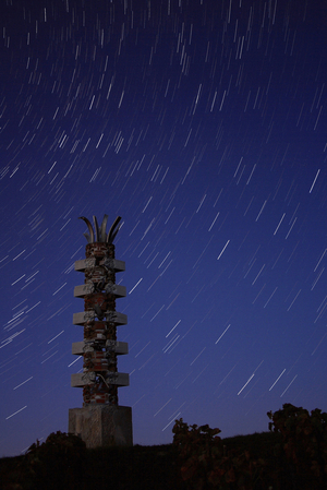 Stars - Star trails - Stars on a sculpture located in Mailly - Champagne (Marne). This sculpture by Bernard Pages represents the element “” terre””. It is a public commission to pay tribute to the philosopher Gaston Bachelard (1884 - 1962), originally from Champagne - Ardenne. Star trails above a sculpture in Mailly - Champagne (Marne, France)