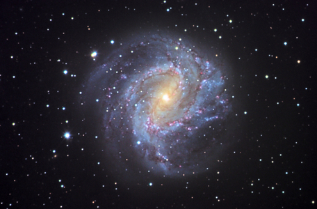 Spiral Galaxy M83 in Hydra - Spiral galaxy M83 in Hydra - The galaxy M83 (NGC 5236) is located about 15 million years away from Earth. This galaxy is intermediate between a classic spiral and a barree spiral. M83 (NGC 5236) is located in the southern constellation Hydra at 15 million light years from the sun. It is classified as intermediate between normal and barred spiral galaxies