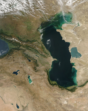 Caspian sea area seen from space - Caspian sea area seen from space - Satellite photo of the Caspian Sea obtained by Aqua satellite on 30 September 2004. The borders are drawn. In the upper left portion of the image, the southwestern - most portion of Russia spreads across the broad plains north of the Caucasus Mountains. Georgia runs along the southern face of the Caucasus Mountains and part of the southeastern shore of the Black Sea. In the small valley and plains south of Russia and on the central shore of the Caspian Sea, Azerbaijan sprawls until butting up against the mountains of Armenia and northern Iran. Another small piece of Azerbaijan is tucked away on the far side of Armenia. Stretching far from the southern shores of the Black Sea into the mountains and deserts of the Middle East is eastern Turkey, while in the bottom right corner, Syria and Iraq mark the northern edges of the Syrian Desert. The Reshteh - ye Kuhha - ye Alborz Mountains curve in a bright green arc around the southern end of the Caspian Sea in northwestern Iran, while on the far side of the Caspian Sea, Kazakhstan (upper right) and Turkmenistan (lower right) sprawl across the Urstyurt Plateau. Three major lakes stand out like jewels against the mountains in the lower left portion of the image - Lake Van in eastern Turkey, Lake Sevana in Armenia, and the turquoise - hued Lake Urmia in northwestern Iran. Like the Caspian Sea, the bright colors are likely due to sediment in the waters. Image taken by satellite Aqua on September 30, 2004. NB: borders are marked