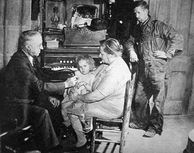 Country doctor visits poor farming family in Scott County, Missouri, 1942 (b/w photo)
