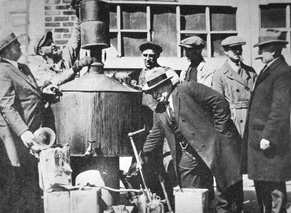 Federal US agents discover an illegal alcohol still during the American Prohibition  (1920-33) (b/w photo)