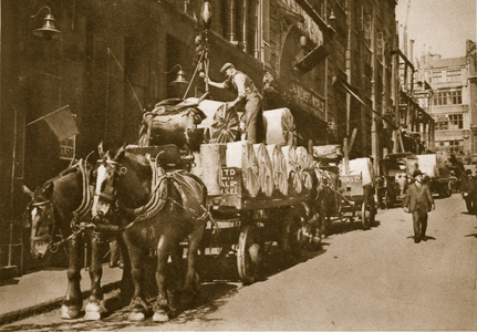 Hoisting the paper into the Newspaper office (sepia photo)