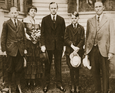 Calvin Coolidge, with his father, wife, and sons (sepia photo)