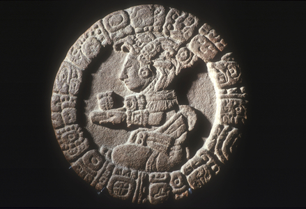 Stone disk with a Mayan figure (carved stone)